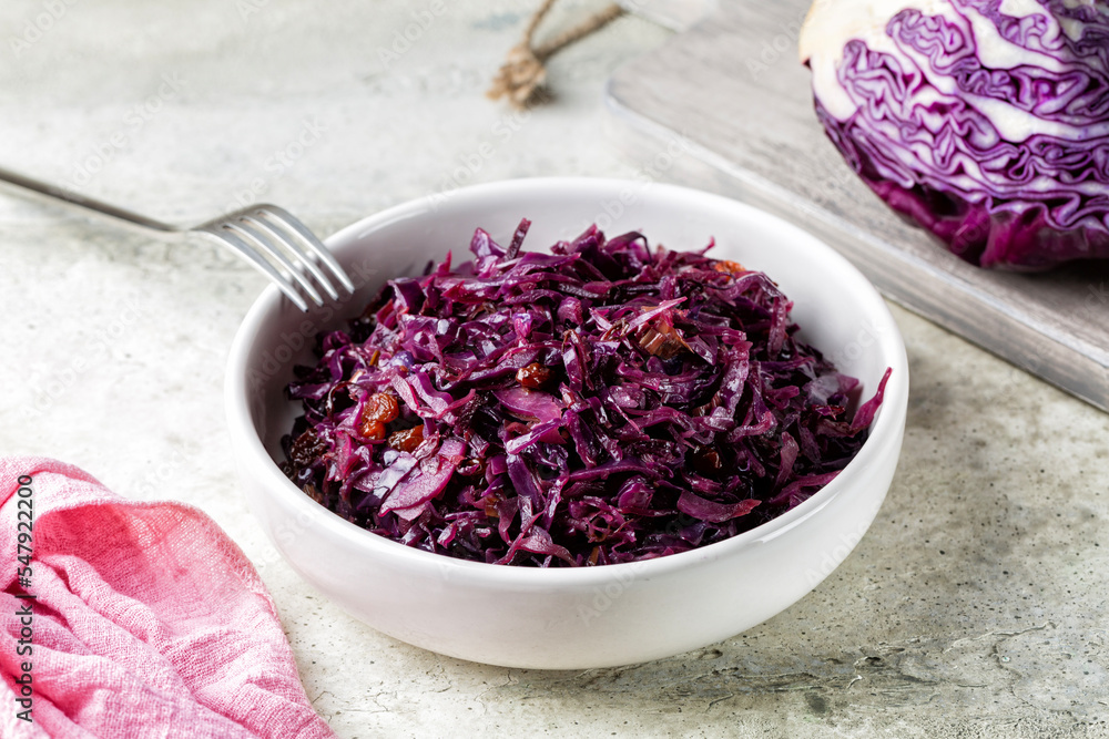 Braised red cabbage with onion, raisins, vinegar and wine.
