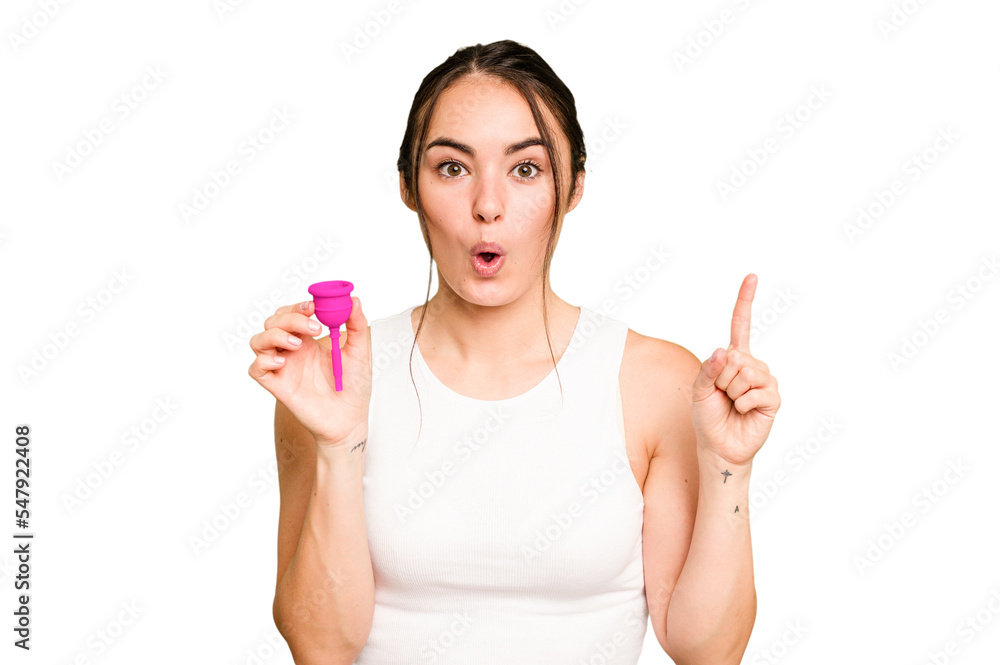 Young caucasian woman holding menstrual cup isolated on green chroma background having some great idea, concept of creativity. Young caucasian woman holding menstrual cup isolated on green chroma background having some great idea, concept of creativity.