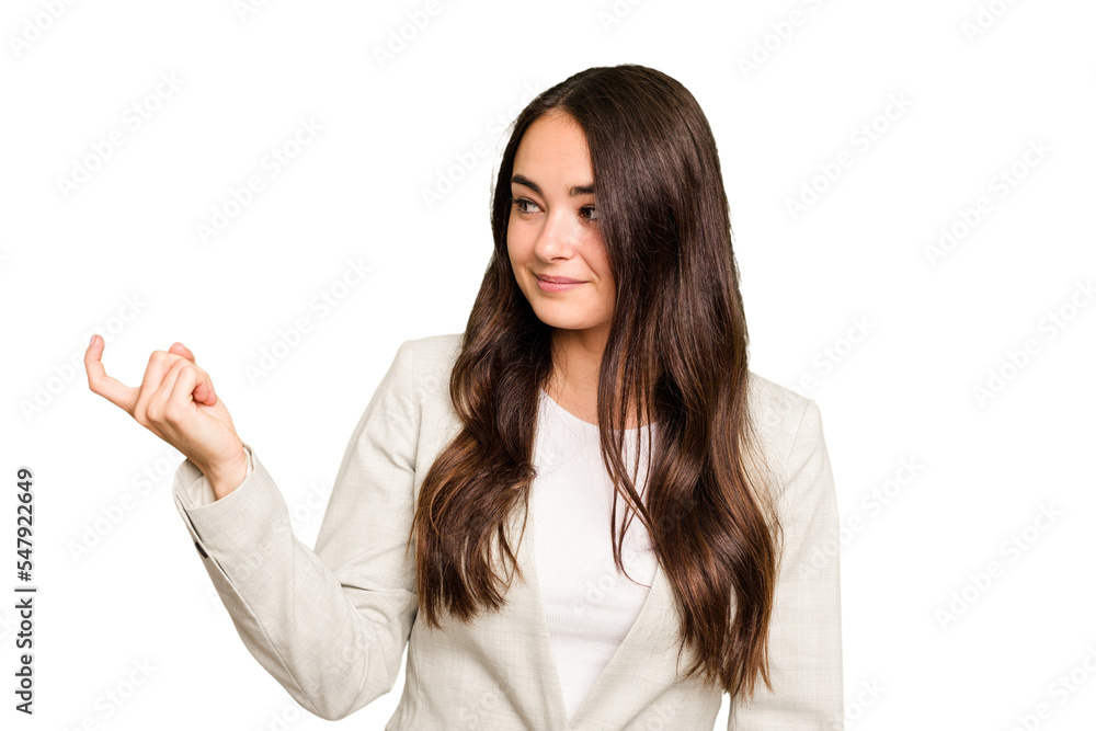 Young caucasian woman isolated on green chroma background pointing with finger at you as if inviting come closer.