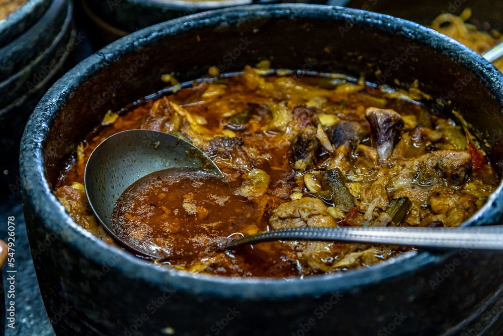 roast meat in a pot on the lunch table, self-service catering