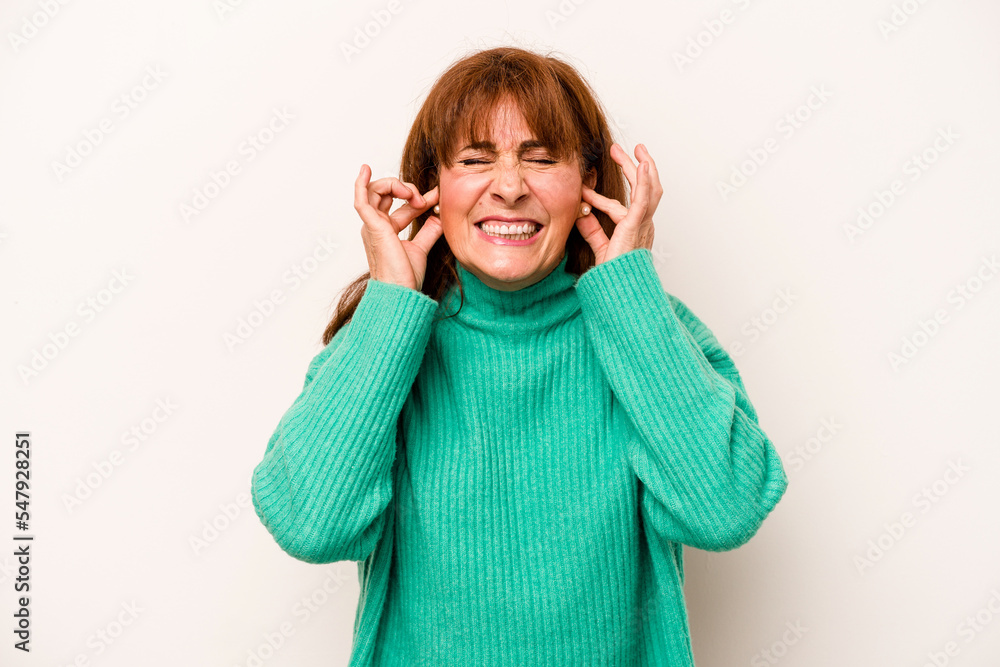 Middle age caucasian woman isolated on white background covering ears with hands. Middle age caucasian woman isolated on white background covering ears with hands.