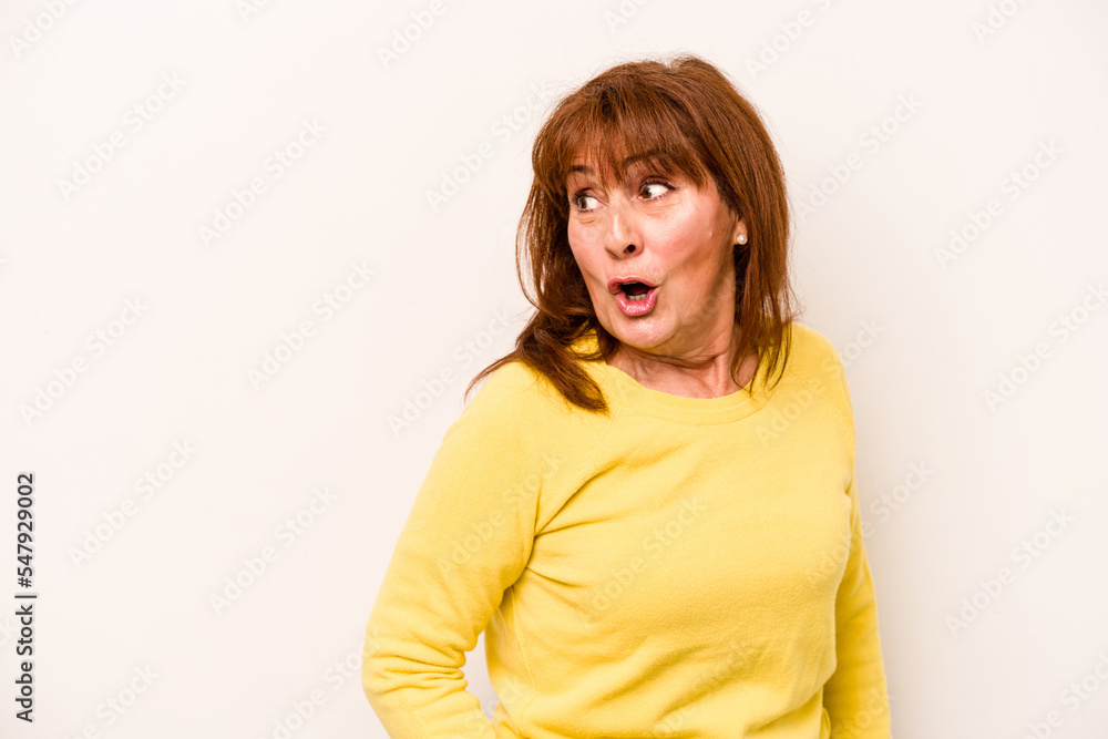 Middle age caucasian woman isolated on white background looks aside smiling, cheerful and pleasant. Middle age caucasian woman isolated on white background looks aside smiling, cheerful and pleasant.