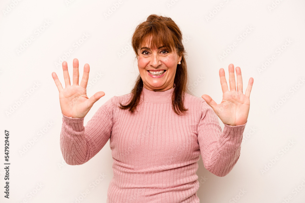 Middle age caucasian woman isolated on white background showing number ten with hands. Middle age caucasian woman isolated on white background showing number ten with hands.