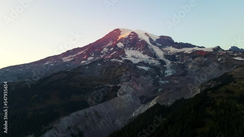 Mount Rainer cinematic shot sunset aerial drone 4k,also known as Tahobet is a large active stratovolcano in the Cascade Range of the Pacific Northwest, located in Mount Rainier National photo