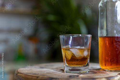 Close-up of a glass of whiskey with ice cubes