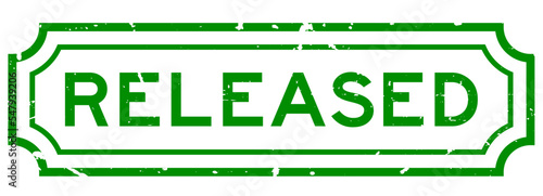 Grunge green released word rubber seal stamp on white background
