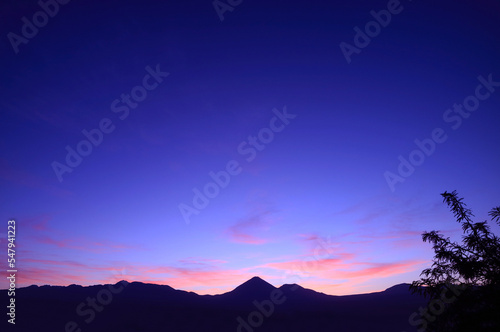 Amazing twilight sky over the silhouette of mountain range in Atacama desert, northern Chile, South America