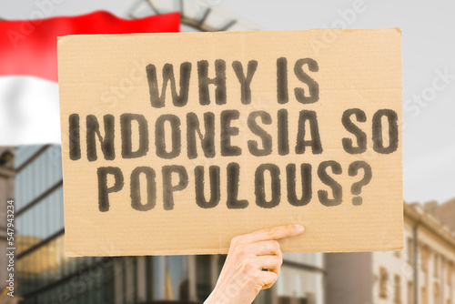 The question " Why is Indonesia so populous? " is on a banner in men's hands with blurred background. Demography. Humanity. Forecast. Leadership. Future. Money. Prediction. Citizen. Data. Directional
