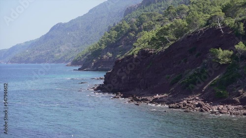 Views of mountains and mediterreanean forest in a cove in Mallorca photo