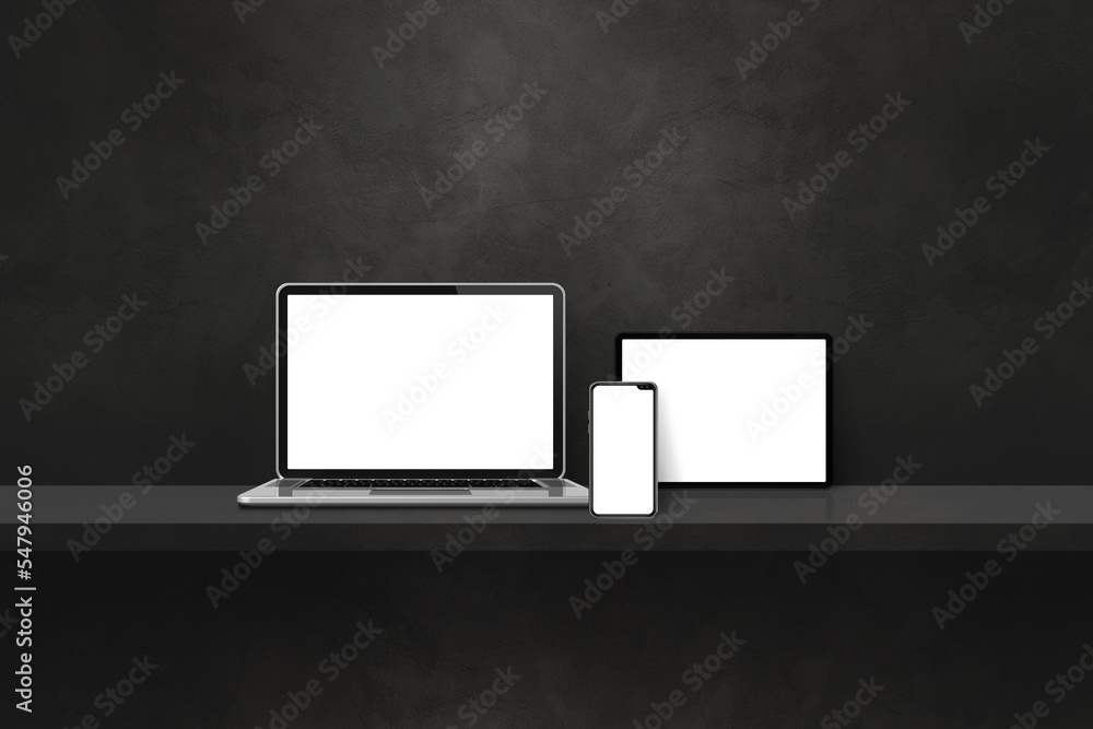 Laptop, mobile phone and digital tablet pc on black wall shelf. Horizontal background Laptop, mobile phone and digital tablet pc on black wall shelf. Horizontal background