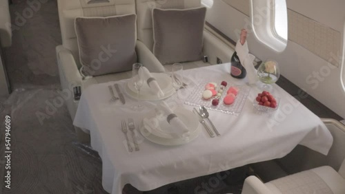 private jet interior with laid table