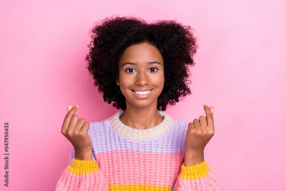 Portrait of candid good mood girl with wavy hairdo wear knit sweatshirt fingers show little likes symbol isolated on pink color background Portrait of candid good mood girl with wavy hairdo wear knit sweatshirt fingers show little likes symbol isolated on pink color background