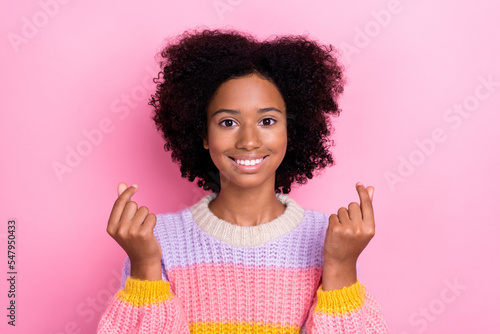 Portrait of candid good mood girl with wavy hairdo wear knit sweatshirt fingers show little likes symbol isolated on pink color background