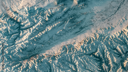 Aerial view of mountain landscape. Snow covered mountains winter background. Earth landscape view in winter. Earth observatory from satellite. Elements of this image furnished by NASA