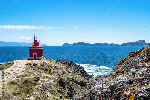 Red lighthouse in Punta Robaleira, Costa da Vela, Pontevedra, Galicia, Spain