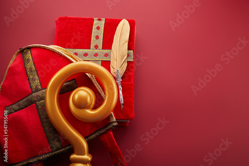 Canvas Print Mitre or mijter staff and book of Sinterklaas on red backgroud