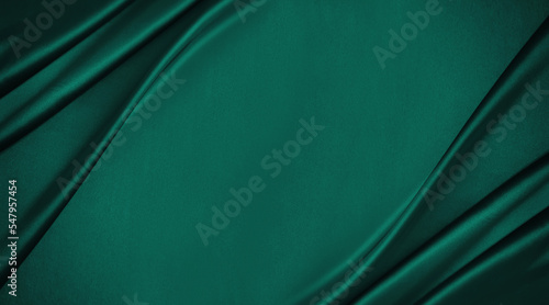 Obraz na płótnie Dark teal green silk satin. Shiny smooth fabric. Soft folds. Luxury background with space for design. web banner. Flat lay, top view table. Birthday, Christmas, Valentine, New year. w salonie