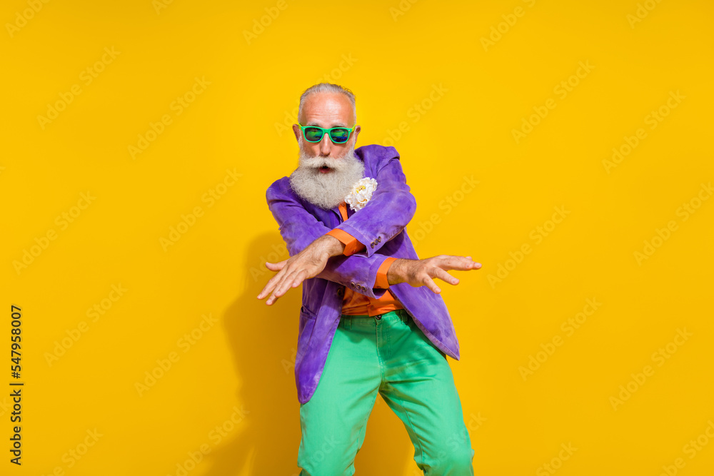 Photo portrait of handsome granddad have fun dancing enjoy entertainment wear trendy colorful garment isolated on yellow color background