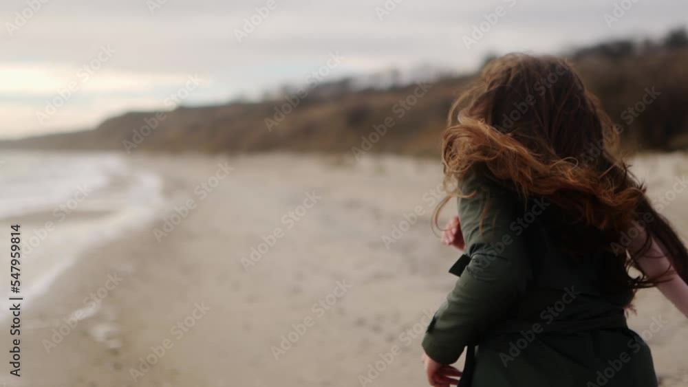 Happy pretty mixed ethnic woman running away on sandy sea beach. Playful smiling asian female airy hair blowing in wind. Pov follow me shot of girl having fun on beach. Dreamy cinematic slow motion. Happy pretty mixed ethnic woman running away on sandy sea beach. Playful smiling asian female airy hair blowing in wind. Pov follow me shot of girl having fun on beach. Dreamy cinematic slow motion.