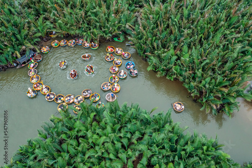 VIEW OF RUNG DUA BAY MAU OR COCONUT WATER ( MANGROVE PALM ) FOREST 7 HECTA IN CAM THANH VILLAGE, HOI AN ANCIENT TOWN, UNESCO WORLD HERITAGE, VIETNAM. HOI AN IS ONE OF THE MOST POPULAR DESTINATIONS photo