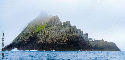 Foggy Island of Skellig Michael seascape taken from the sea, Ireland.
