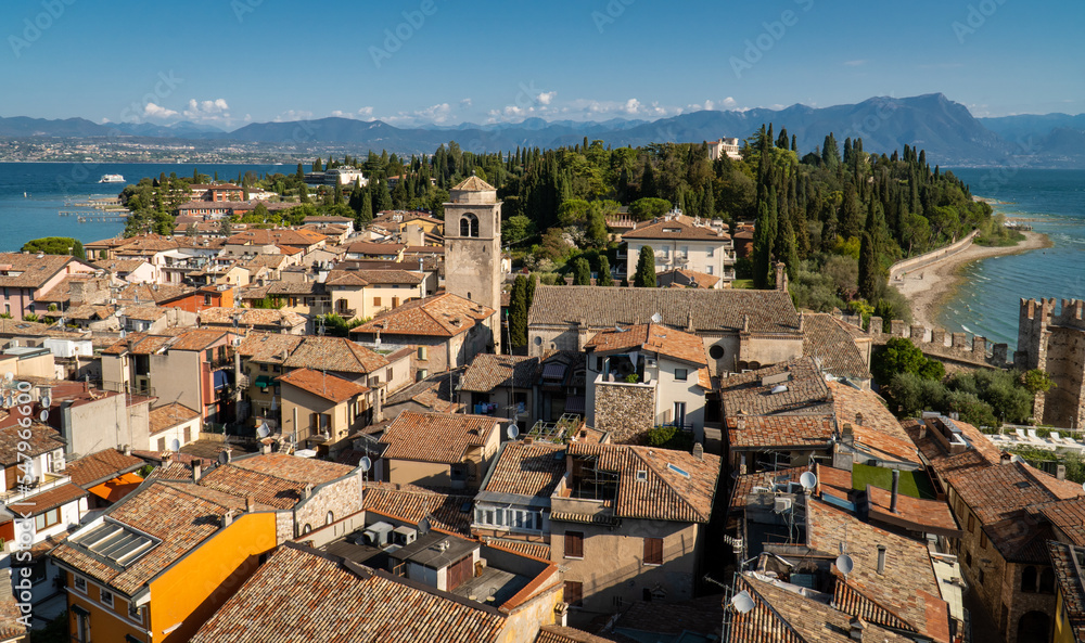 Townscape of Sirmione rooftops in italy taken from Scaligero castle with lake Garda in the background.