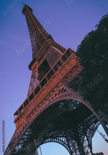 Different take on the Eiffel tower during sunset with dark iron color.