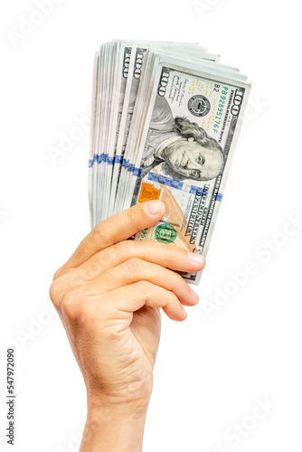 Young caucasian man holding new dollar bills up isolated on white background. American cash, money in hand