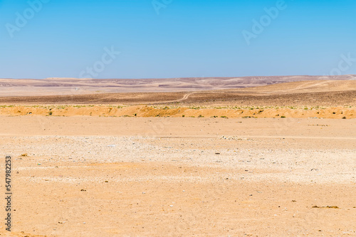 A view across the desert landscape beside the Jordan Valley highway in summertime