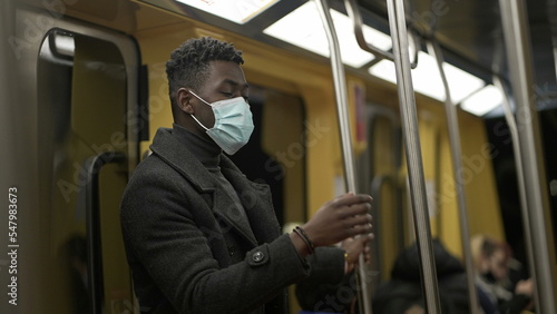 Man taking off covid-19 face mask, end of pandemic while riding train