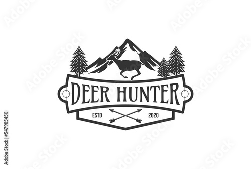 Deer hunting badge logo with a combination of mountain