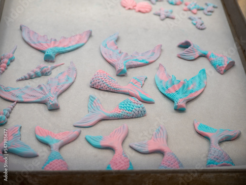 group of sea themed cake toppers like siren , clams and starfish photo