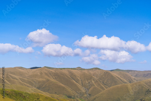 Wonderful spring landscape with sky, mountains and hills