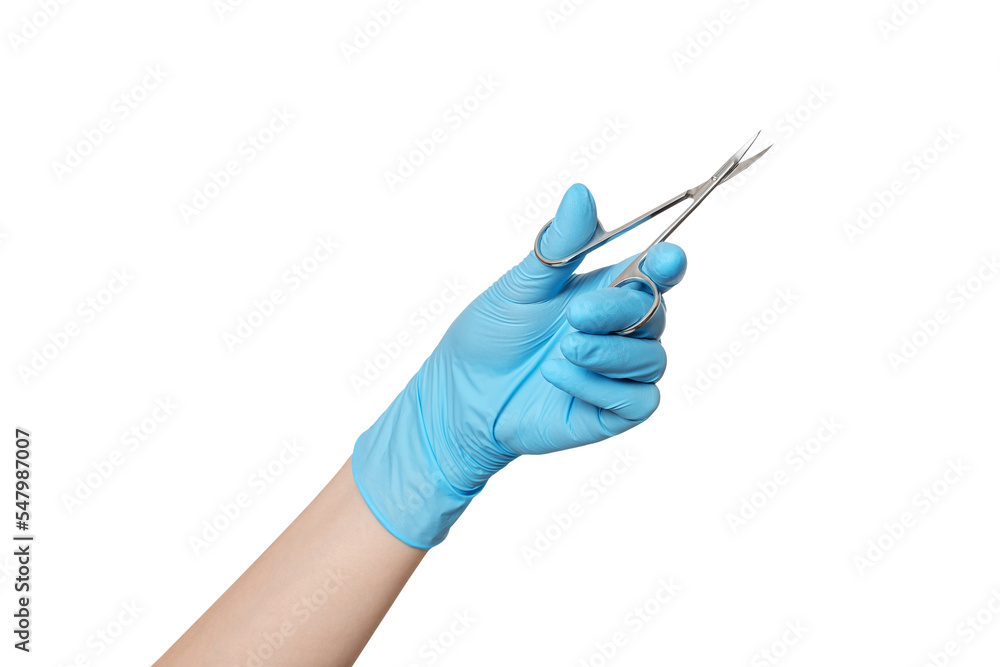 Manicure, nail scissors in hand with blue glove. Hand holding scissors for manicure isolated on white background. Manicure, nail scissors in hand with blue glove. Hand holding scissors for manicure isolated on white background.