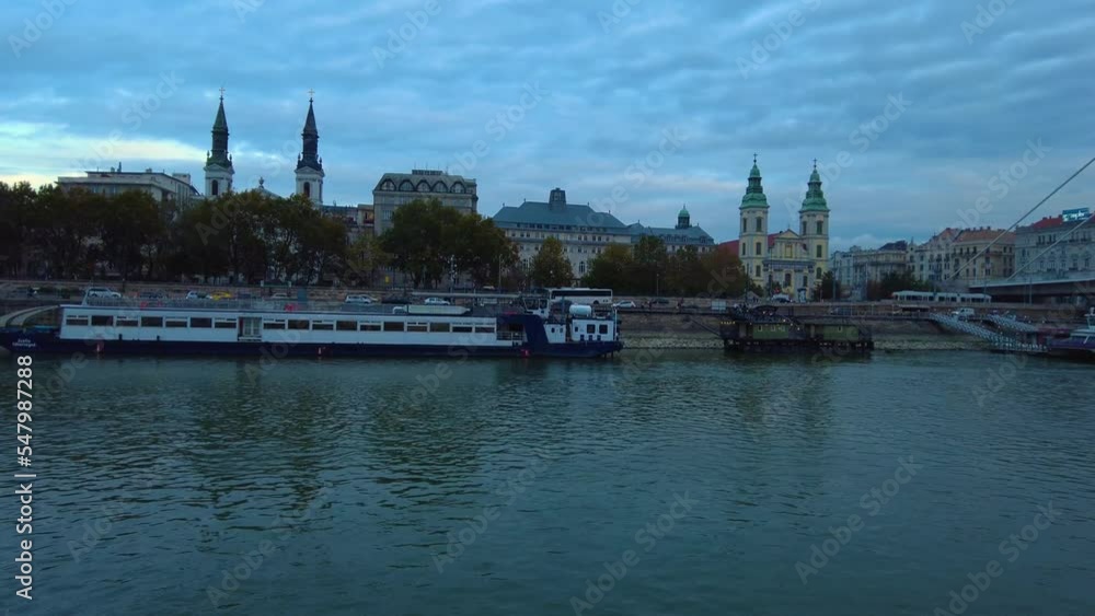 Riding along the Danube river in Budapest on a late afternoon in autumn Riding along the Danube river in Budapest on a late afternoon in autumn