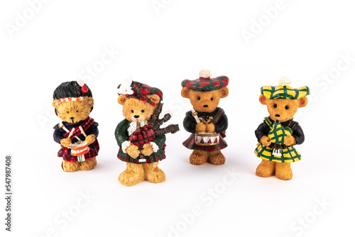 Cute figures of scotish bears playing instruments photo