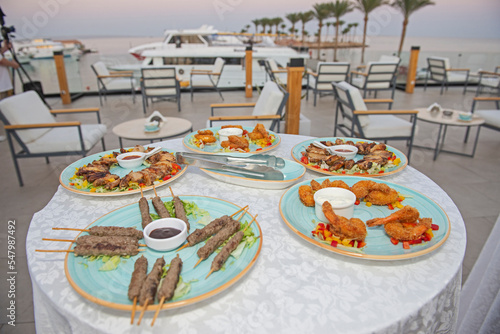 Selction of meat dishes at an outdoor  buffet