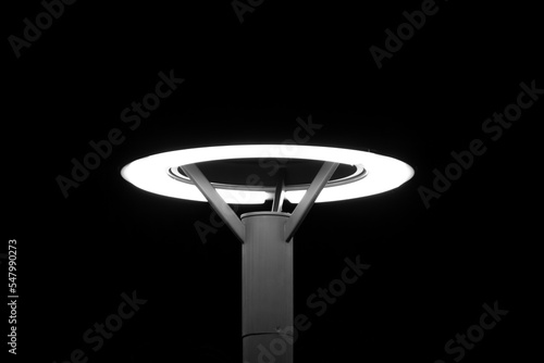 Street lamp post against black background.