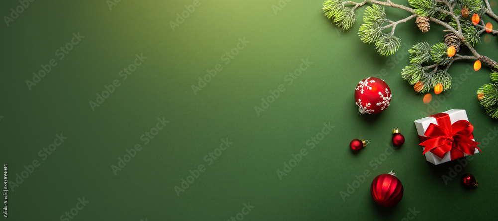 Merry Christmas and Happy Holidays greeting card, frame, banner. New Year. Noel. Red Christmas ornaments and gift on green background top view. Winter xmas holiday theme. Flat lay
Merry Christmas and Happy Holidays greeting card, frame, banner. New Year. Noel. Red Christmas ornaments and gift on green background top view. Winter xmas holiday theme. Flat lay