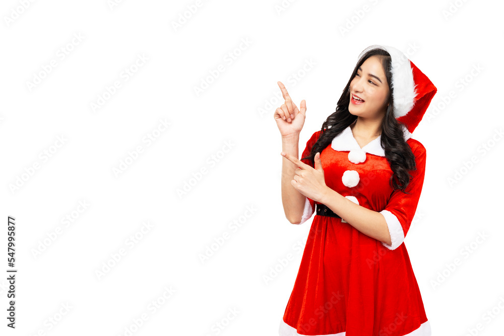 Happy Asian woman wear red Santa Claus outfit and Santa Claus Hat pointing up to copy space with smile face isolated on white background Christmas x-mas winter happiness holiday and party concept Happy Asian woman wear red Santa Claus outfit and Santa Claus Hat pointing up to copy space with smile face isolated on white background Christmas x-mas winter happiness holiday and party concept
