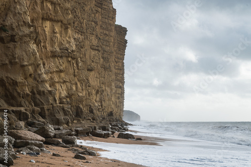 Rock formations, sandstone cliffs in West Bay beach, located near Bridport in Dorset, United Kingdom. Part of famous Jurassic coast, World Heritage Site, selective focus photo