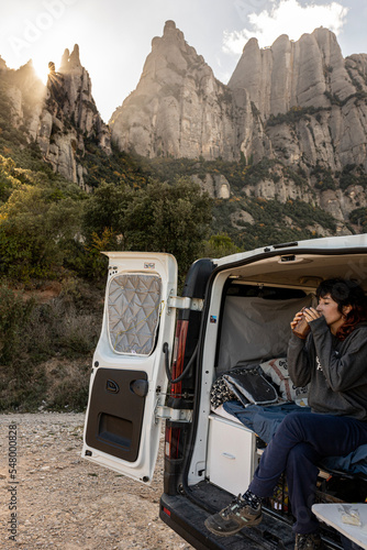 having a hot coffee in the van while watching the sunset in montserrat
