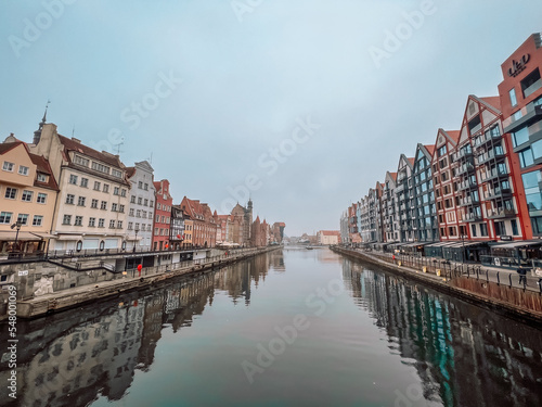 Panorama of Gdansk with beautiful old town over Motlawa river at fog  Poland.
