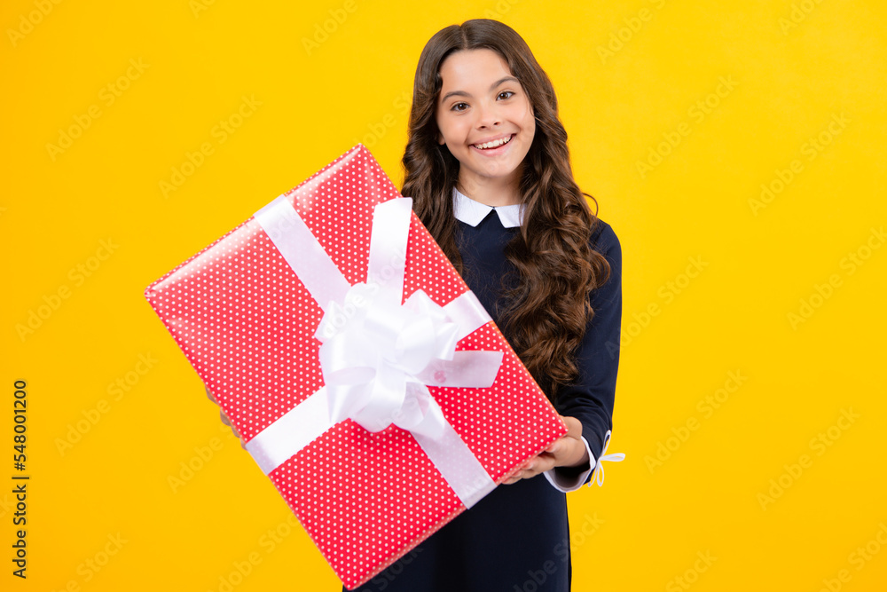 Teenager child with gift box, studio isolated background. Present for birthday, Valentines day, New Year or Christmas. Kid hold present box with gift ribbon bow. Teenager child with gift box, studio isolated background. Present for birthday, Valentines day, New Year or Christmas. Kid hold present box with gift ribbon bow.