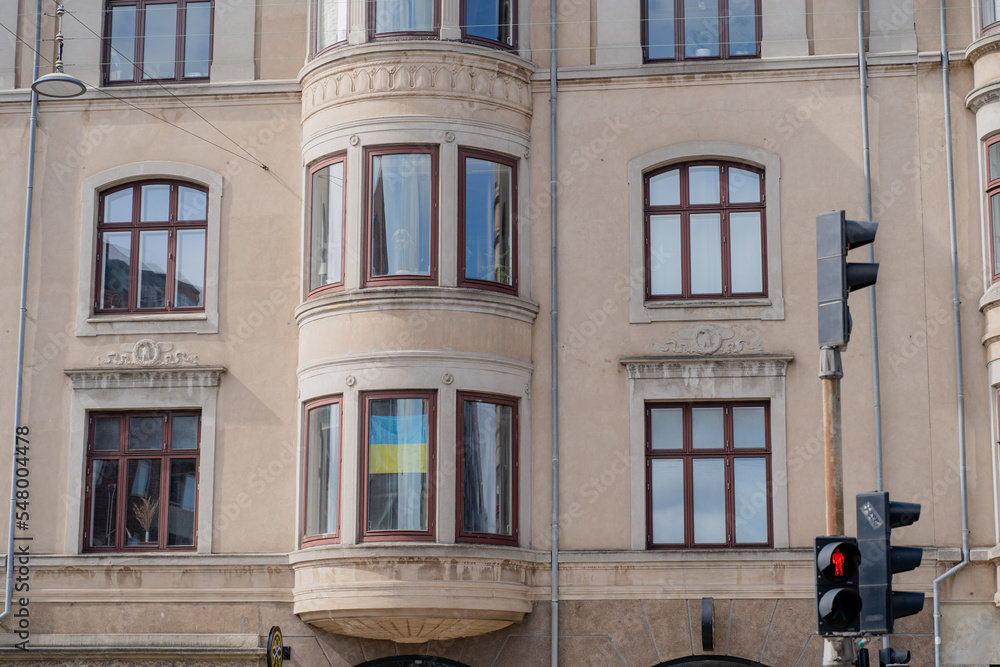 Ukrainian flag. The flag of Ukraine hangs in the windows in support of Ukraine over Russian aggression.