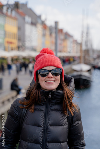 Canvas Print Hand gesture. Woman waving in the city of Copenhagen. Denmark.
