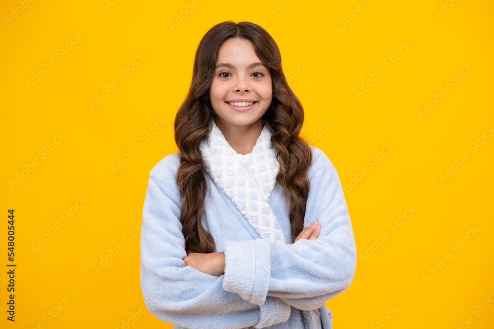 Teenager girl crossed arms isolated on yellow background. Studio portrait of child with mock up copy space. Teenager girl crossed arms isolated on yellow background. Studio portrait of child with mock up copy space.