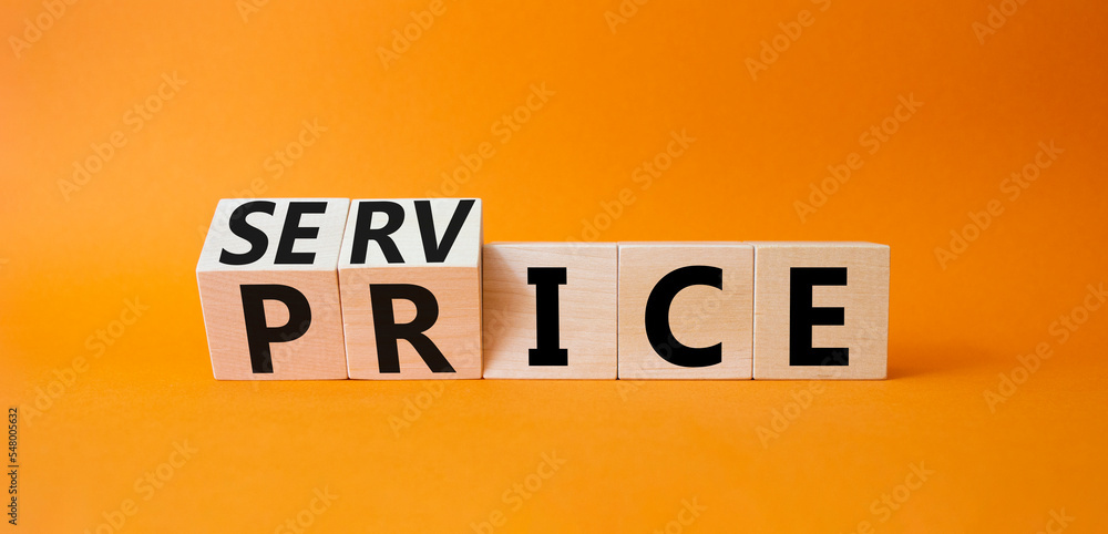 Obraz premium Service and price symbol. Turned wooden cubes with words service and price. Beautiful orange background. Business and service and price concept. Copy space