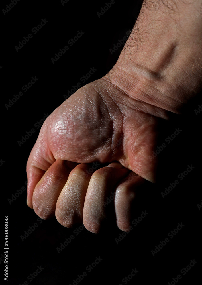 hand of a person in the dark