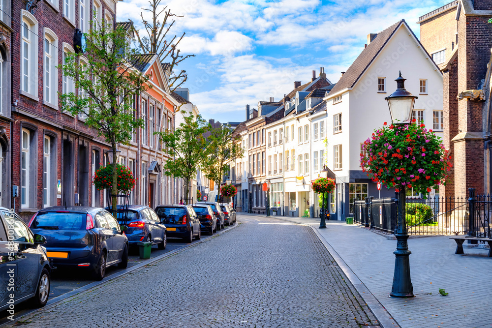 Maastricht, Netherlands. Traditional residential area with buildings, flowers and street
